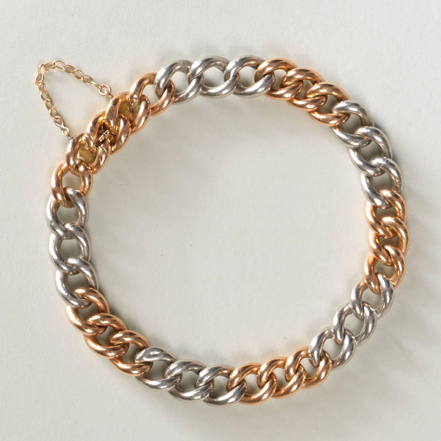 A 15 carat gold and platinum curb link bracelet, 19th century, England.

weight: 23.99 grams
dimensions: 20 x 0.9 cm