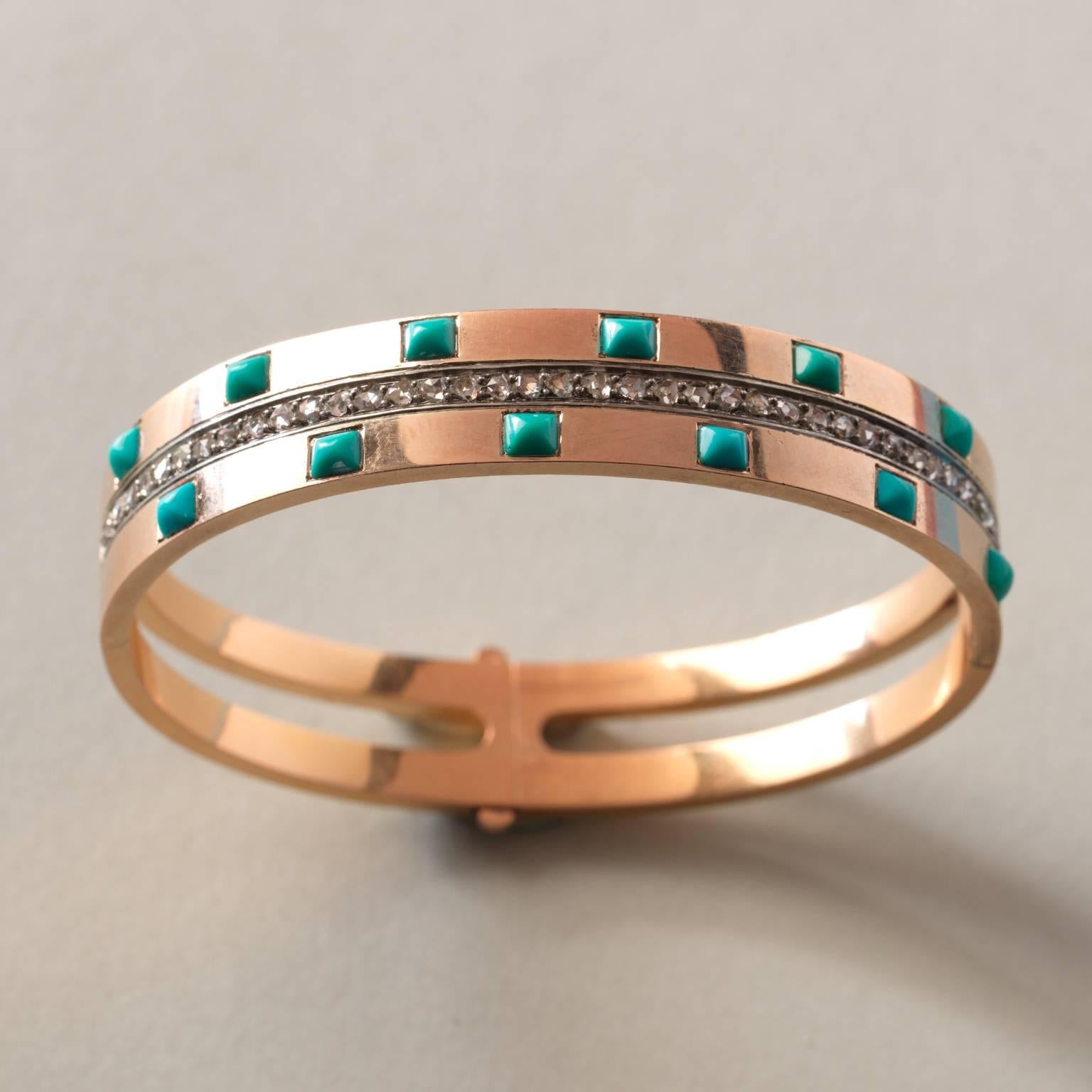 An 18-carat gold French bangle set with sugarloaf cut turquoises on each side of a band of rose cut diamonds, worn French master mark, numbered: 54, circa 1870.

weight: 23 grams
size: 48 x 57 mm
width: 11 mm
diameter: 16 cm