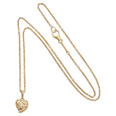 An 18k Gold Cartier Heart Pendant with Diamond