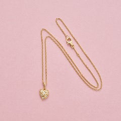An 18k Gold Cartier Heart Pendant with Diamond