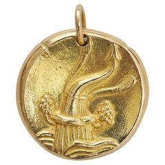 An 18k Gold Van Cleef & Arpels Aquarius Zodiac Pendant