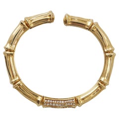 Una pulsera tipo brazalete «Bamboo» de Cartier, de oro de 18 quilates con un diamante