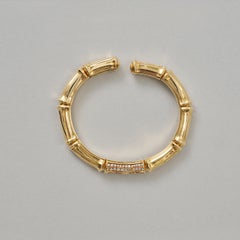 Un bracciale rigido Cartier Bamboo in oro 18 carati con diamanti