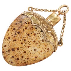 An 18k Gold Pendant with palmoxylon