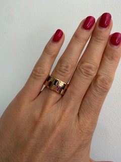 An 18k Gold Band Ring with Green and Pink Tourmaline Baguettes