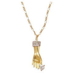An 18k Gold Hand Charm with Diamonds on Chain