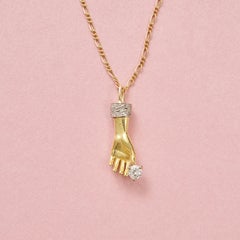 An 18k Gold Hand Charm with Diamonds on Chain