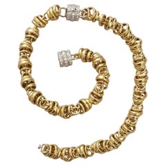 A set of 2 18k gold and diamond Pomellato bracelets or one chain
