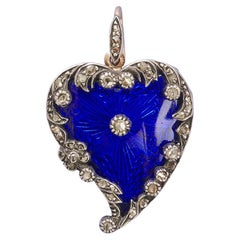 A Victorian Gold Heart pendant with diamonds set in silver and enamel