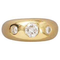 gold three stone Cartier ring with diamonds