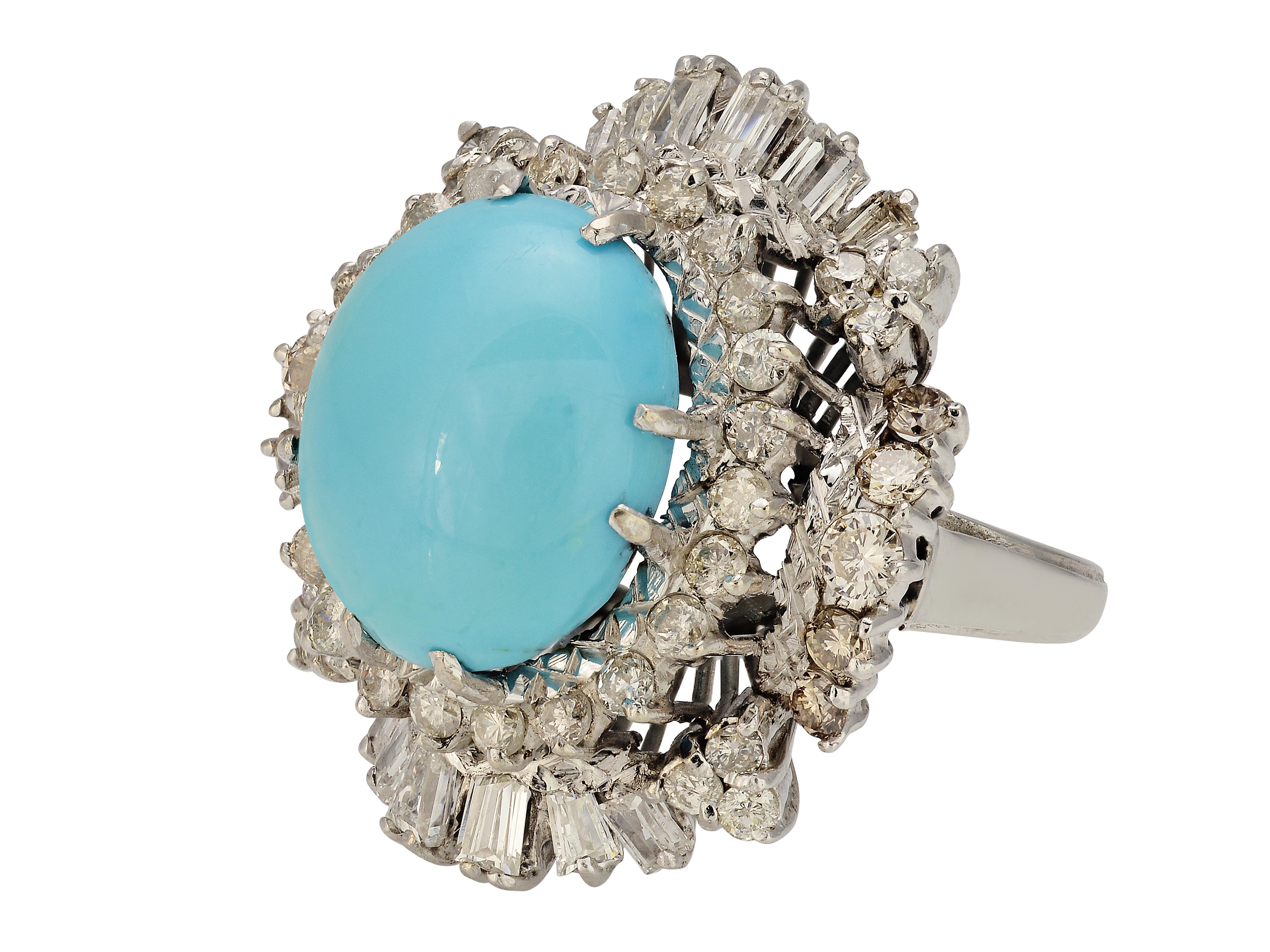 18 karat white gold vintage ballerina style cocktail ring featuring a gorgeous robin's egg blue Persian turquoise cabochon center measuring 12.5mm x 14.5mm. The turquoise is surrounded by 67 round and baguette diamonds totaling approximately 2