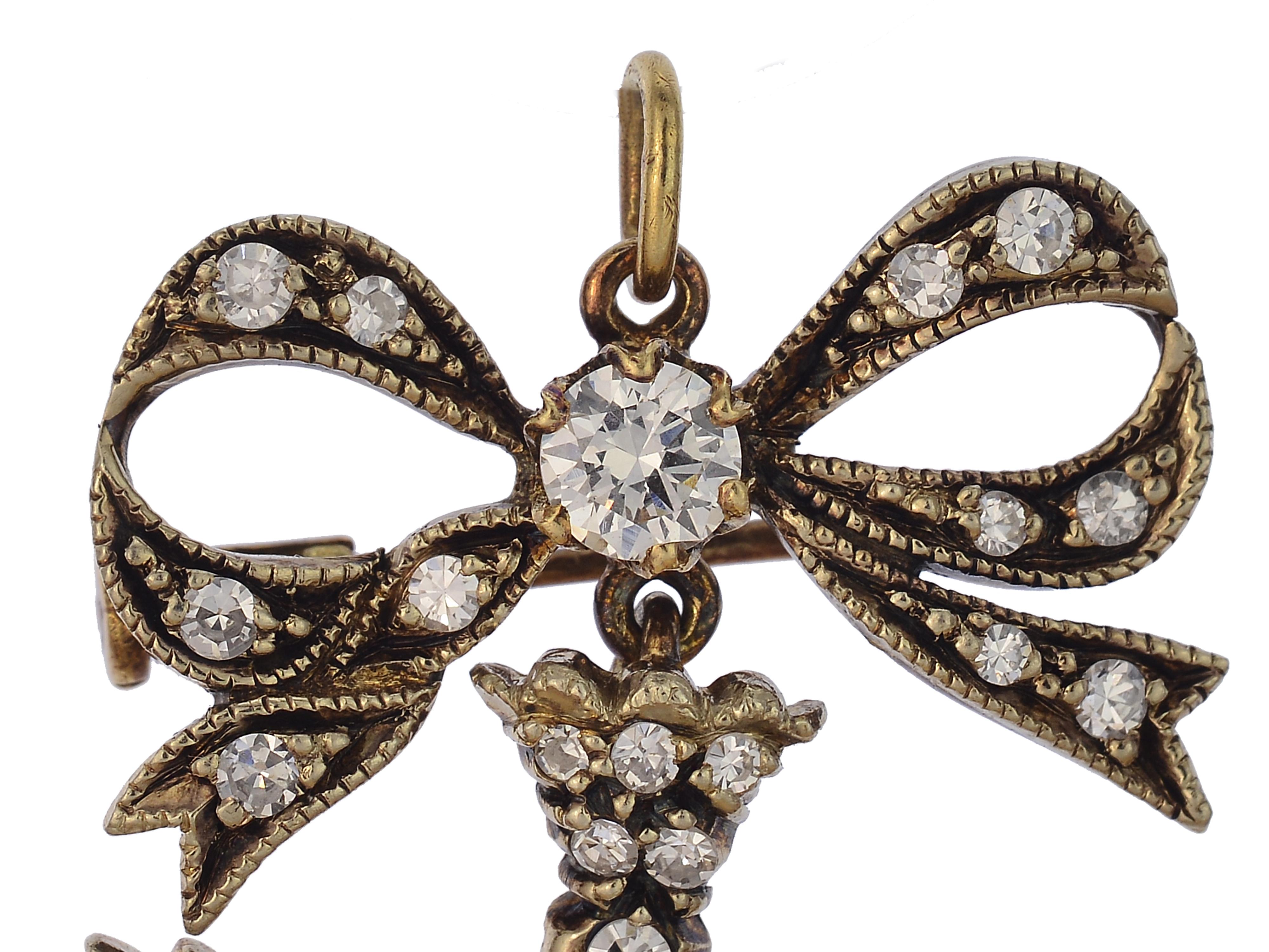 18 Karat Yellow Gold Convertible Pendant With 40 Round Brilliant & Single Cut Diamonds Totaling Approximately 1 Carat Total Weight VS Clarity & G Color Diamonds, 9 Seed Pearls, and 2 Ruby Eyes. The Pendant Also Features a Brooch Mechanism.