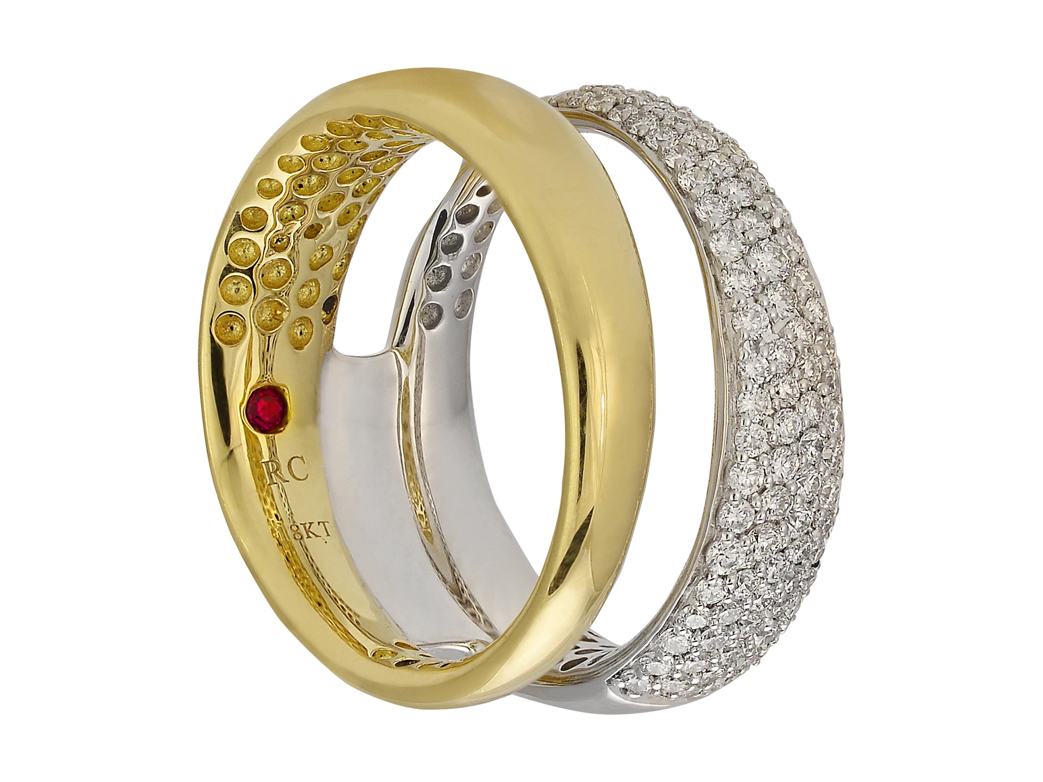 18 karat white and yellow gold pave diamond ring from Roberto Coin Scalare Collection. The ring design is connected in the back, giving the illusion of two stacked rings in the front. The prong-set round brilliant cut diamonds total 0.68 carats,