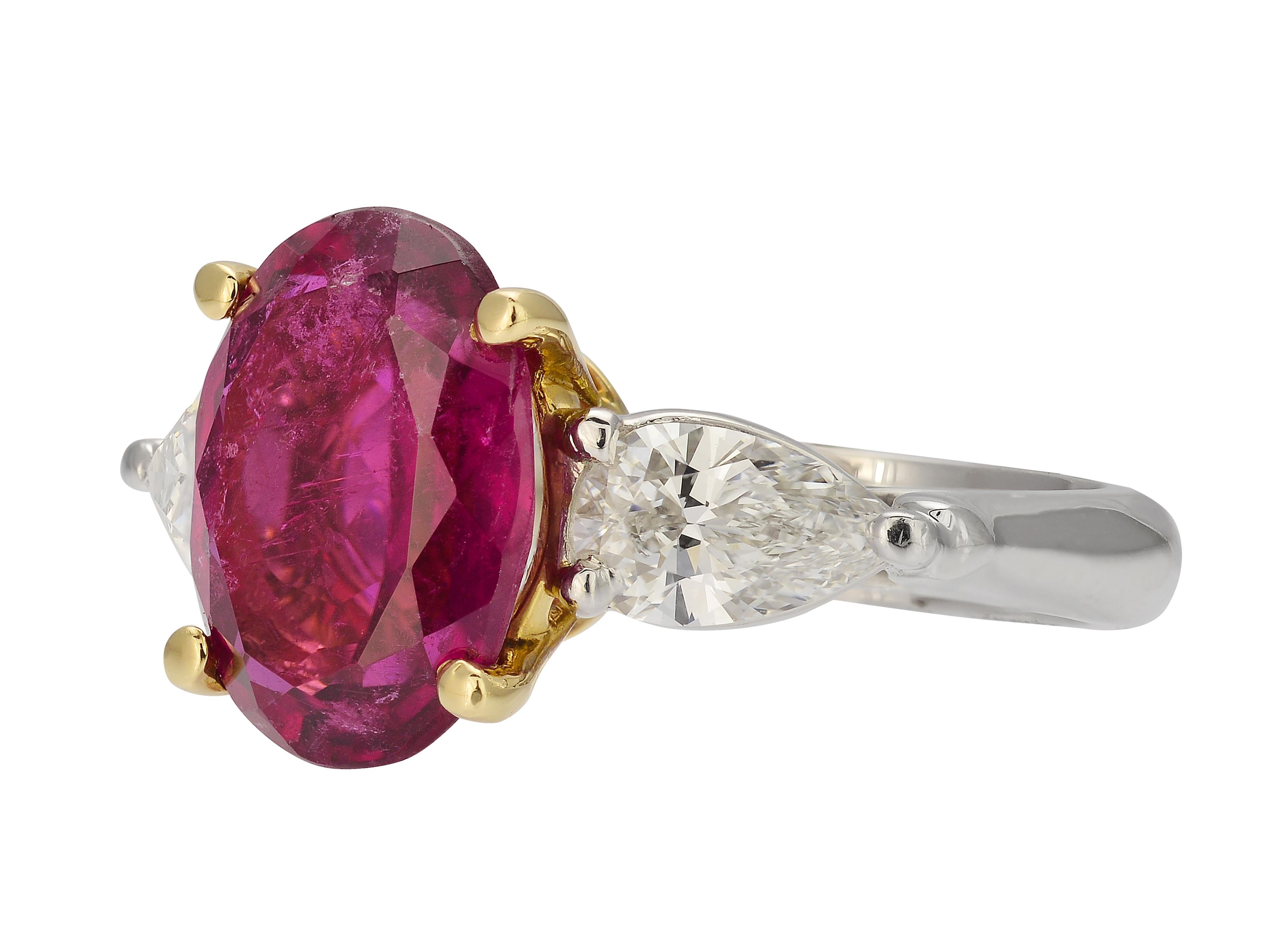Platinum & 18 Karat Yellow Gold Cocktail Ring Featuring A 4.06 Carat Oval Cut Pink Tourmaline With 2 Pear Shaped Diamonds Totaling 1.02 Carats Of VS2 Clarity & F Color. Natural Inclusions Visible In Tourmaline. Hidden Hearts Under Gallery. Purchase
