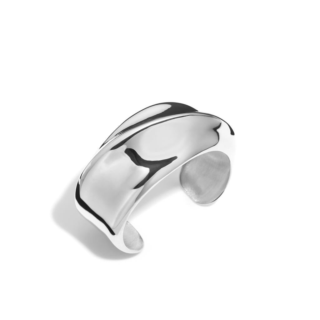 AGMES Sterling Silver Sculptural Twisted Cuff.
Handmade in NYC.  
Inspired by urban landscapes, architecture and modern art, the collection creates a feminine geometry expressed through clean lines and sculptural silhouettes. 
