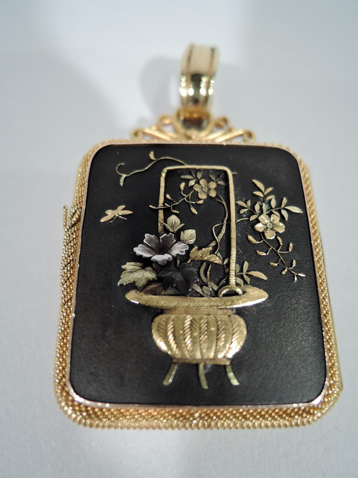 Fabulous Meiji shakudo locket with delicate gold braid border. Rectangular with gold and silver applied to shakudo ground. (Shakudo is a lacquer-shaded alloy.) One side are peacock and bamboo with Mount Fuji in background. On other is flower basket.