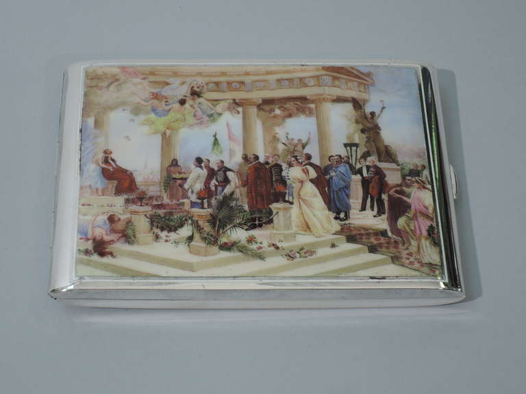 Cigarette case in 900 silver with enameled Classical scene. Made by FM in Austria, ca. 1900. Rectangular with side hinge. Unusual tableau on cover: a portico with figures in Classical and 19th-century court dress, a modern city in the background.