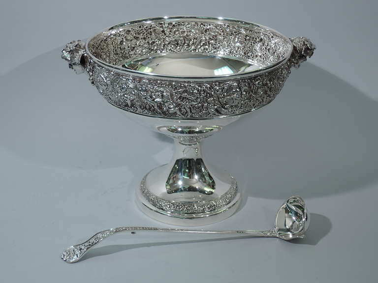 A fine sterling silver punch bowl and ladle in the Olympian pattern. Made by Tiffany in New York, ca. 1900. 

Punch bowl: bowl has curved sides and rests on concave and conical foot. Repousse border depicting the gods at play. They embrace, flirt,