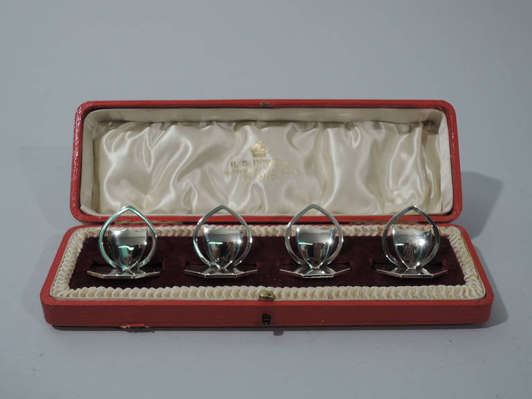 Edwardian sterling silver place card holders. Made by James William Benson in Birmingham in 1909. Each: heraldic shield set in oval frame and mounted to hexagonal base. A sleek and modern version of an old fashioned motif. Hallmark includes