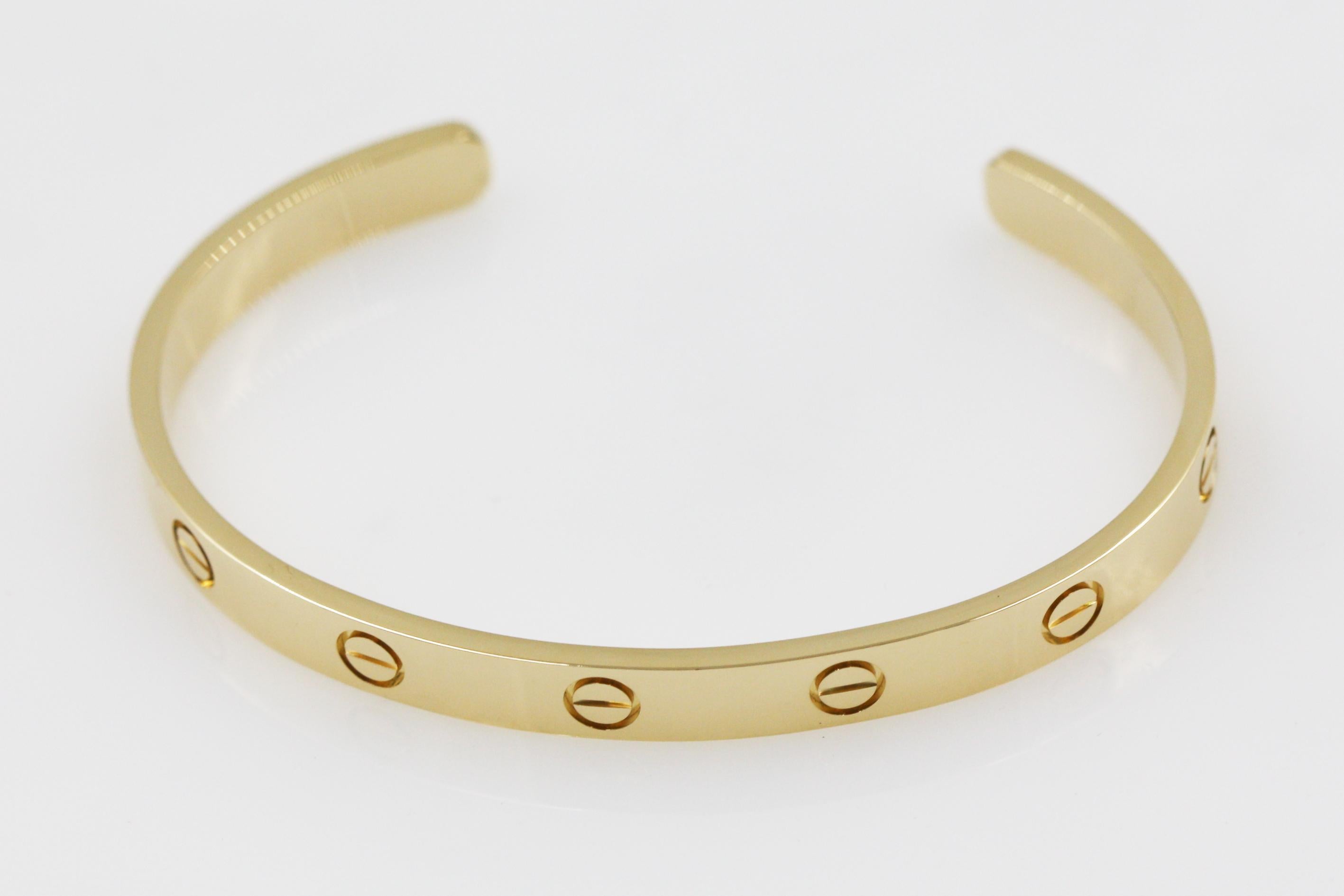A beautiful cuff bracelet from Cartier Love collection, made in 18K yellow gold. The bracelet have the iconic screw motif.

Size: 17
We have other size available, please feel free to ask.

Item comes with an original box and certificate.