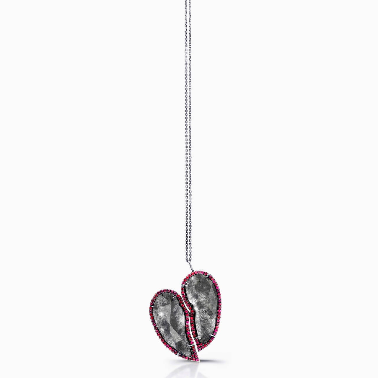 18k blackened gold, black diamond slice heart necklace with ruby micro pave. Hangs on 18k blackened gold 16