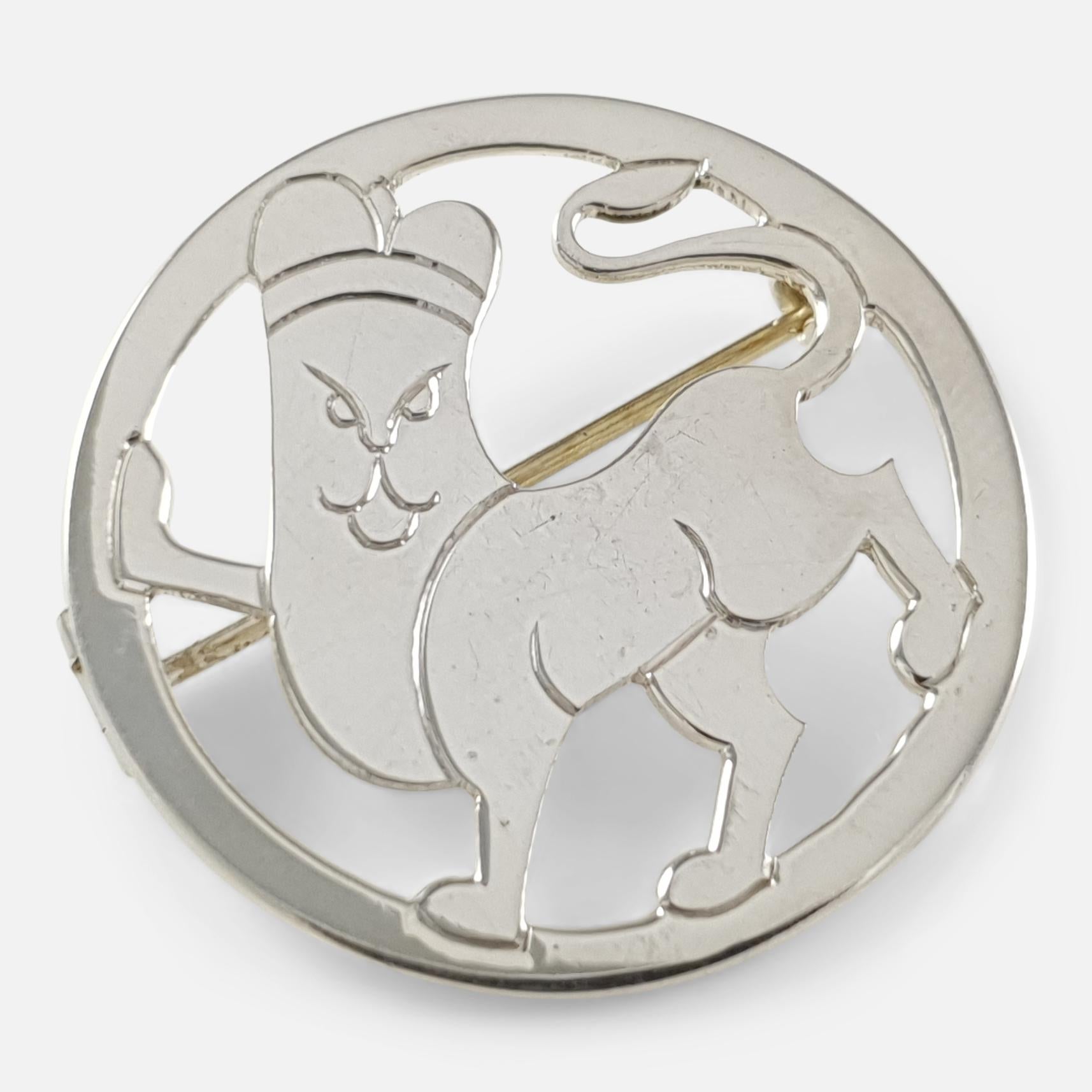 An Art Deco sterling silver brooch in the form of a lion by H.G. Murphy. The brooch is stamped with London hallmarks for 1933, and the maker's mark 
