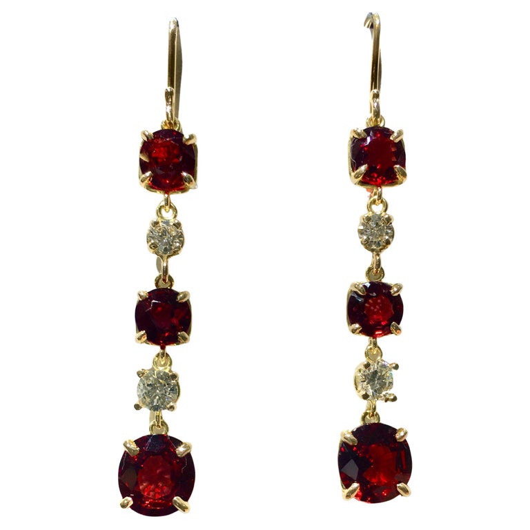 Ultra fine unheated Burma Red Spinel and Diamond Drop Earrings in 18K Yellow Gold. 
The cushion cut red spinel pair on bottom weigh a total of 3.02 carats and the four antique cushion cut spinel on the top weigh a total of 3.05 carats.  The four