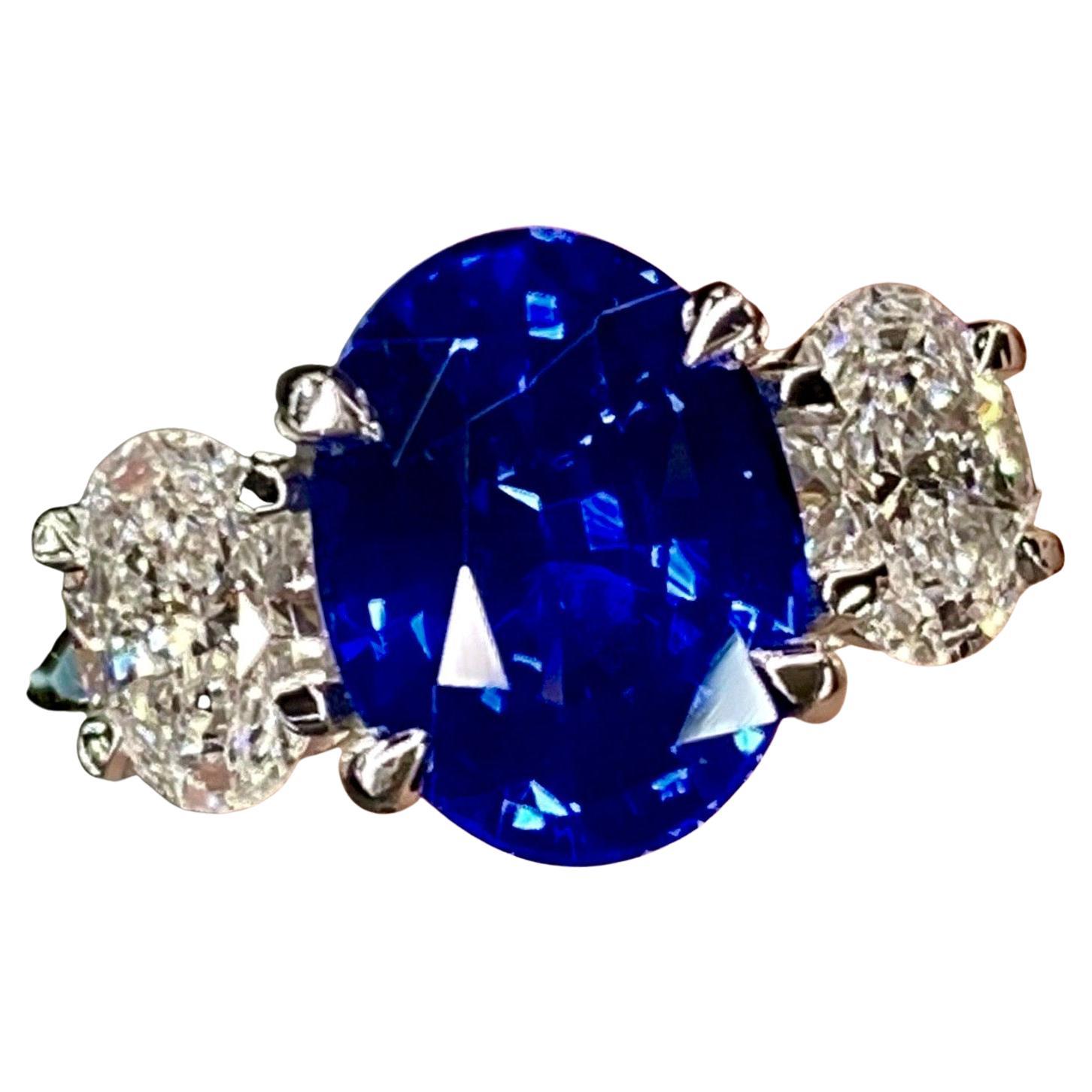 ***Made to order to your finger size, custom options are available, don't hesitate to inquire***
The Center Stone is a gorgeous 2.50 Carat Oval Cut Intense Velvet Blue Burmese Sapphire that Measures approximately 9.0 x 6.1mm. This Sapphire with