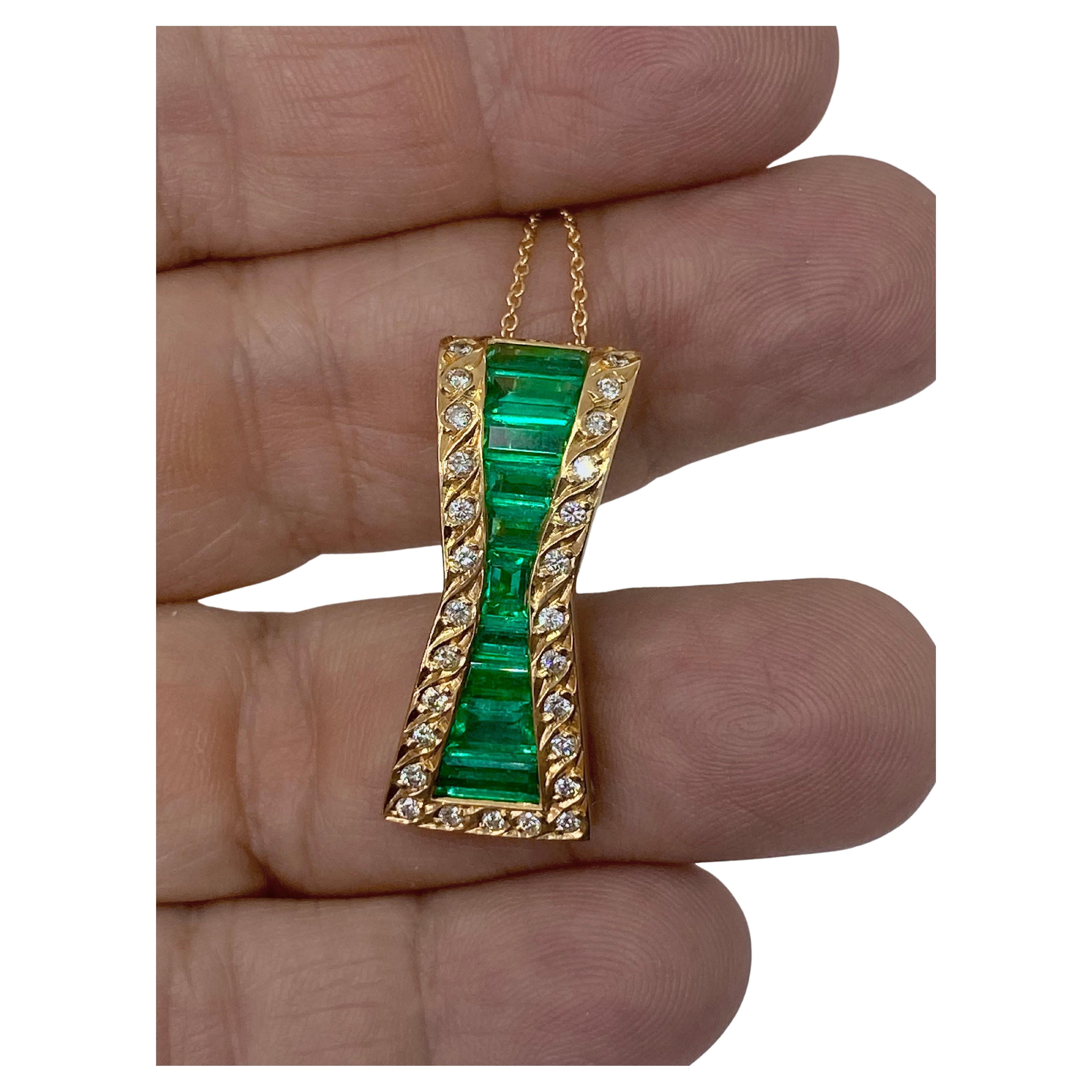 One of a kind Fine AAA Muzo Emerald and Diamonds Pendant Enhancer GIA Certified
Muzo Emerald: 4.00 Carats  - 100% Natural (Moderate treatment)
Baguette-Cut  100% Natural Colombian Emerald
Color-Alpine Green/ Clarity VS
Solid 18K Yellow Gold