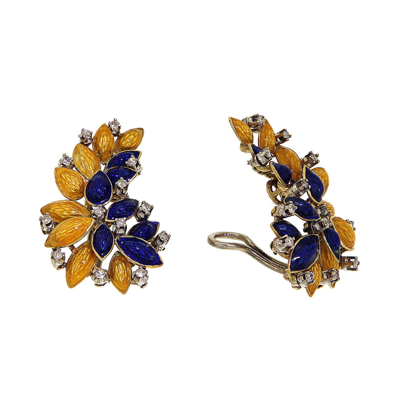Stunning set including brooch, clip-on earrings and ring handmade into a floral pattern. Dating back to the 1950s, this composition is crafted in 18 karat yellow and white gold with yellow and blue enamel. 59 brilliant cut diamonds, weighing 1.00