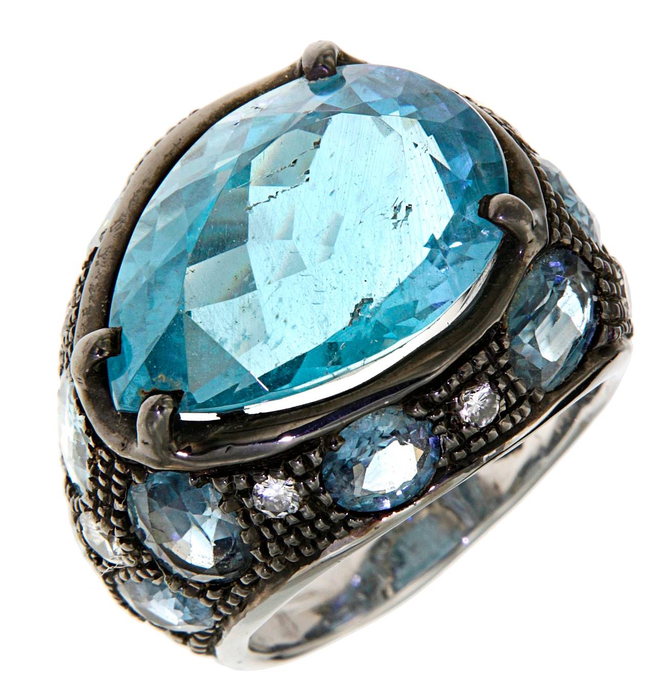 18 carat White Gold Ring with extraordinary Blue Drop-shaped Aquamarine 11.21 carat, Sapphires 8.60 carat and Diamonds 0.40 carat.
Finger Size 6 1/2, can be resized.
