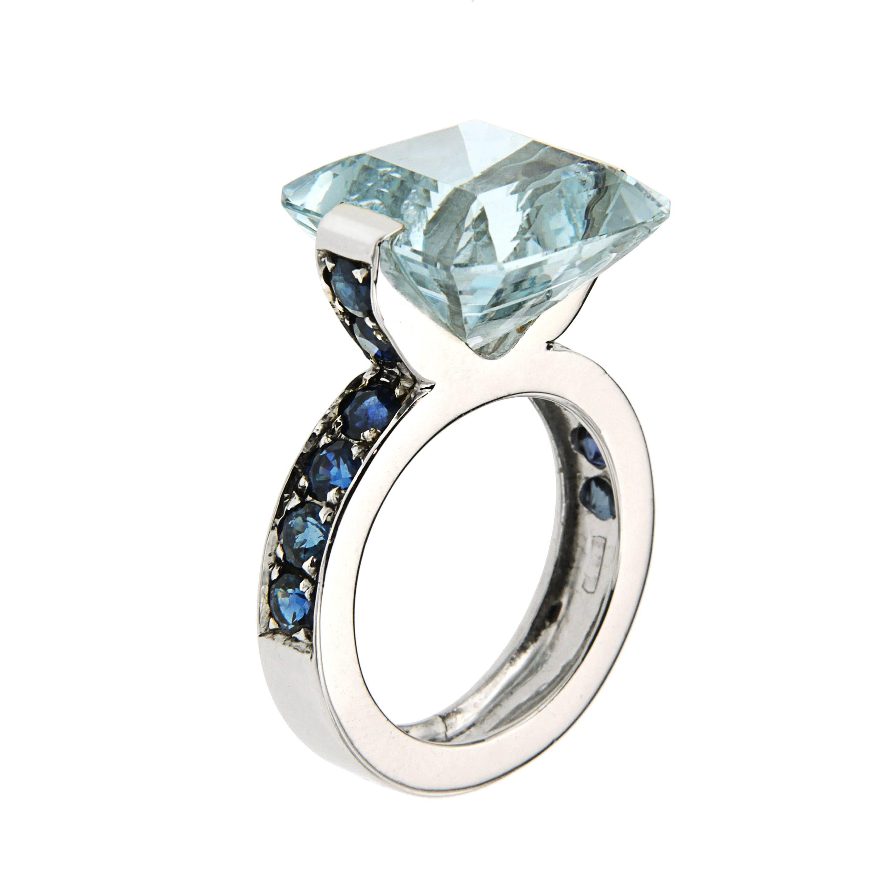 ORIGINAL PRICE 5670,00 euro - NEW PRICE (35% OFF) 3685,00 euro
Modern Design Ring 
White 18kt Gold
Aquamarine 11.90 ctw, 14x14 mm
Blue Sapphires 3.10 ctw
Size 6 1/2, can be sized