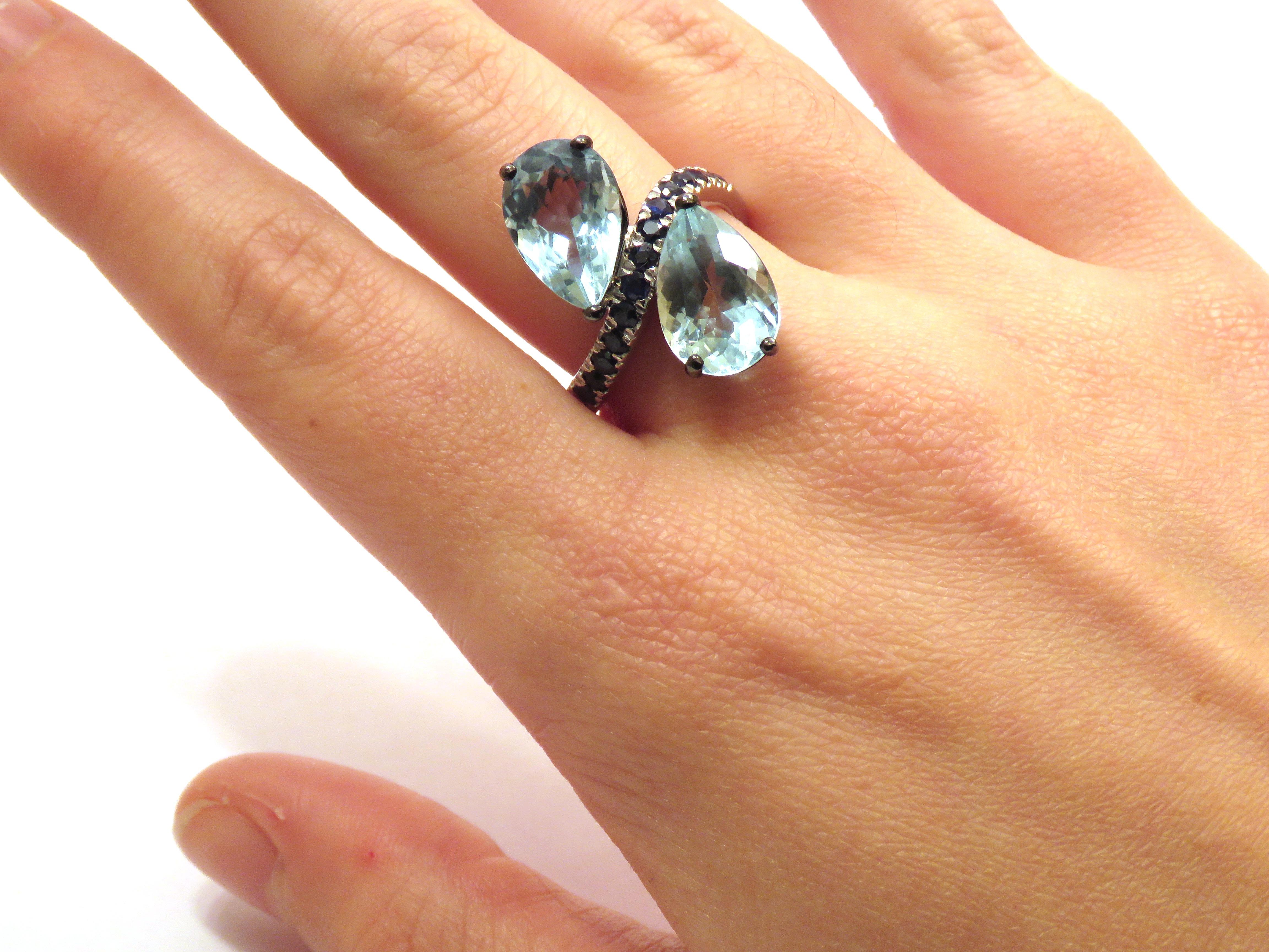 18 karat white gold cocktail ring with two natural aquamarine gemstones 7,40 ctw and sapphires 0,45 ctw. The finger size is: US 7 / Italian 14 / French 54. The ring can be resized on customer's request before shipment. It is handmade by Botta