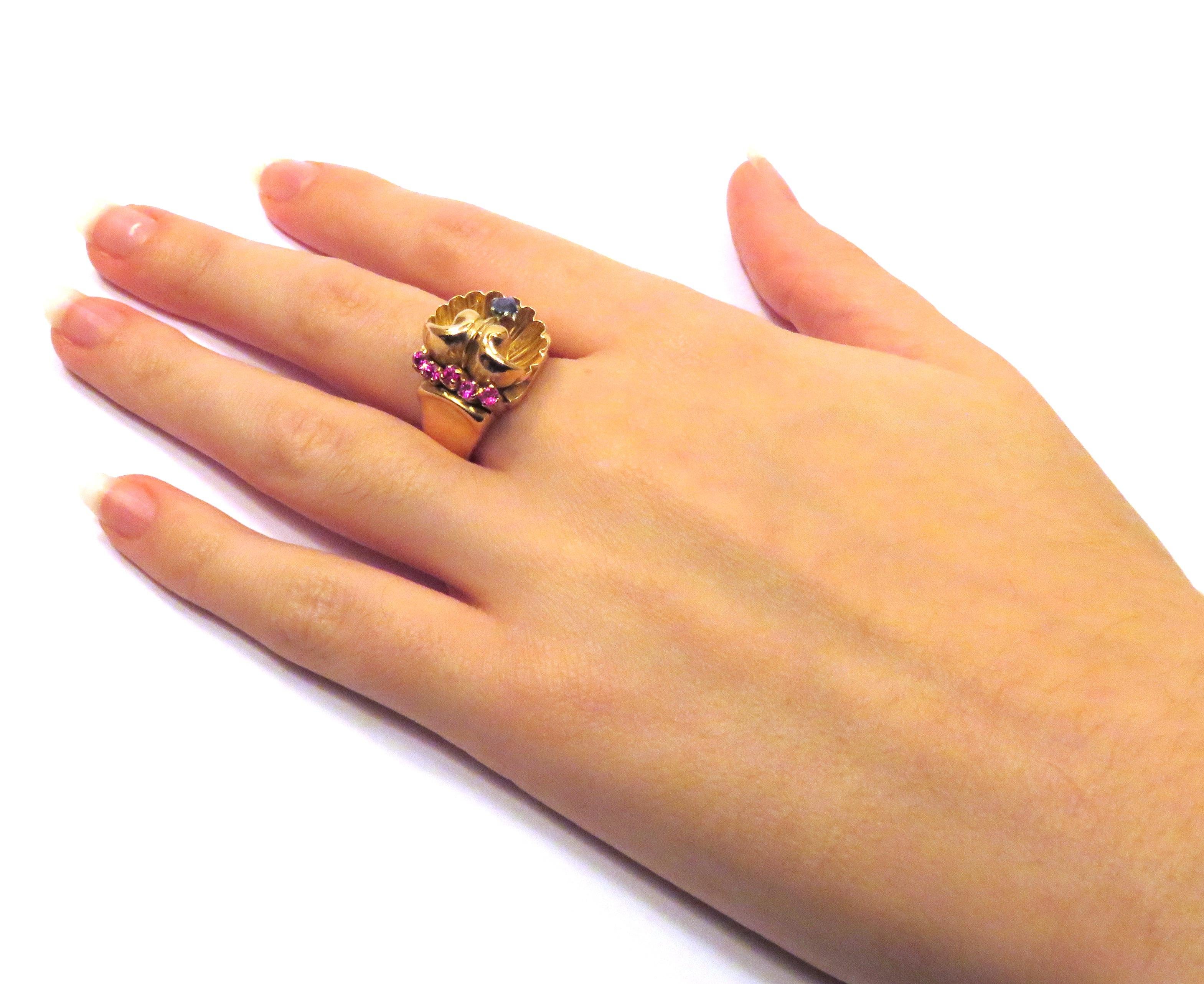 1940s Retro Ring with Five Rubies and Sapphire in 18 kt rose gold, made in Italy
Us finger size 7, it can be resized.
It  is stamped with the Italian Mark 750
________________________________________________________________________

Something about