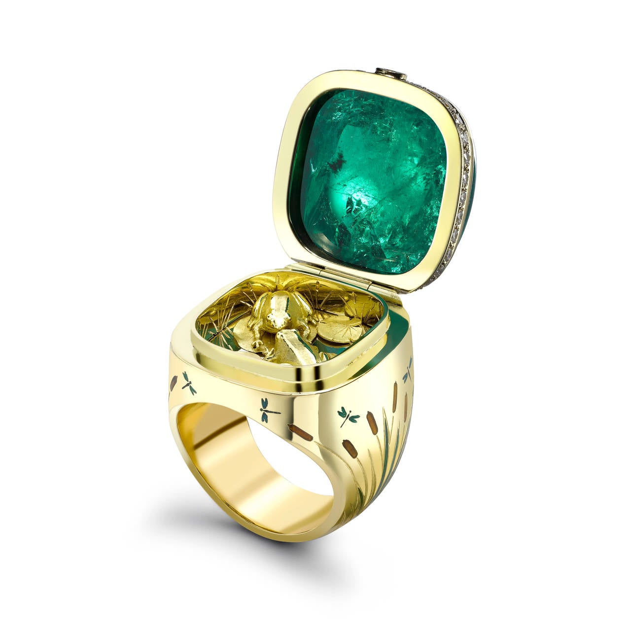 A spectacular 42.66ct sugarloaf Emerald crowns this Masterwork Opening Ring. Surrounded by a deep hand-engraved and enamelled bull rush scene, it opens to reveal two adorable little frogs kissing. 
Gemfields is the world's leading producer of