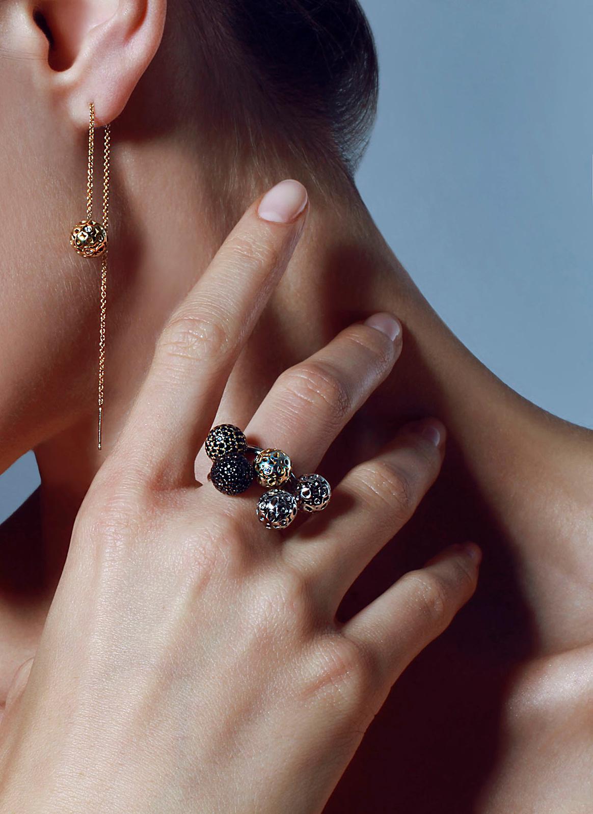 Adjustable U-shape ring with encrusted spheres consisting of Hi June Parker's signature 
Organic circles with white diamonds and pavé ball with black diamonds.

Inspired by seeing the cross-section view of life, as if slicing a tree to see its