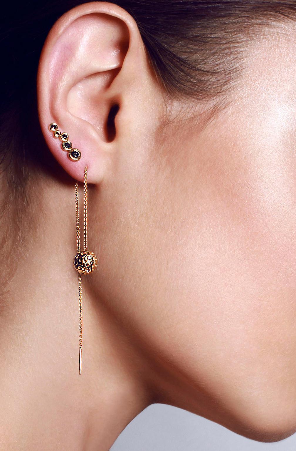 These threader style post earrings with delicate chain are a versatile long earring style that looks great with your hair up or down. The gold balls are composed of two half-spheres consisting of Hi June Parker's signature organic circles.
Fully