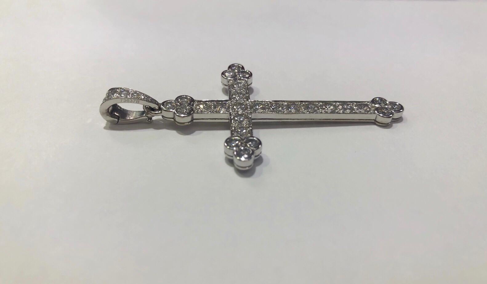 Cartier diamond cross pendant with 2.10 carat total weight in diamonds set in 18k white gold. Pendant measures approximately 43x28mm and the 
bail measures 8x4mm. Comes with Cartier box. Chain not included.

Color: D-F  Clarity: VVS2-VVS1
