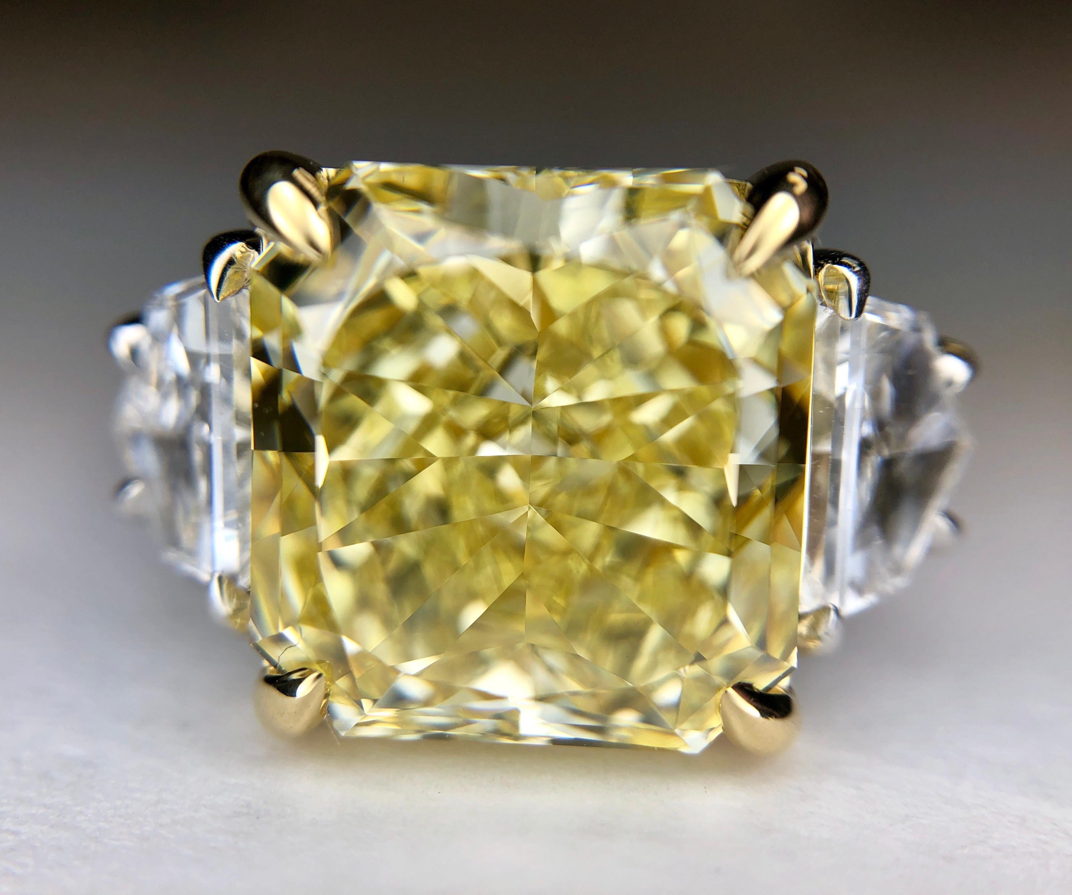 6.84 Carat Natural Fancy Intense Internally Flawless Diamond in a Custom Platinum Ring set with two Cadillac Cut Natural Diamonds Weighing 0.78ct Total. Stunning, classic design. 

Center Diamond: 6.84ct Natural, Fancy Intense Yellow, Even Color.
