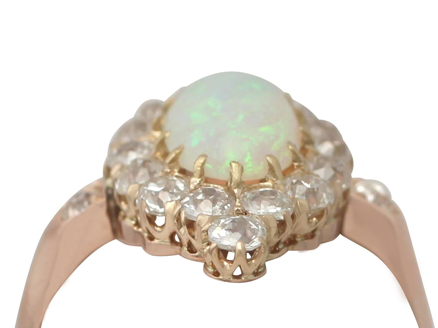 A stunning, fine and impressive antique French 1.06 carat opal and 0.48 carat diamond, 14 karat yellow gold dress ring; an addition to our antique jewellery and estate jewelry collections

This stunning, fine and impressive opal and diamond dress