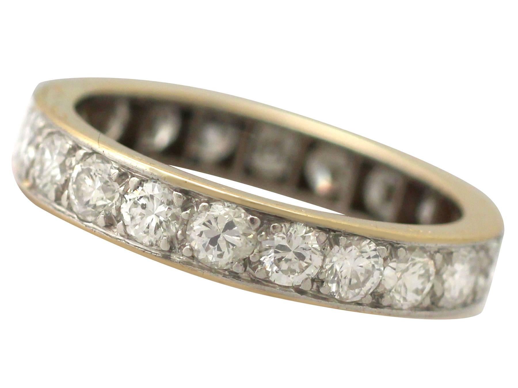 This exceptional, fine and impressive vintage full eternity ring has been crafted in 18k yellow gold with a a platinum setting.

The ring is embellished with twenty-one transitional modern brilliant round cut diamonds, pavé set within a platinum