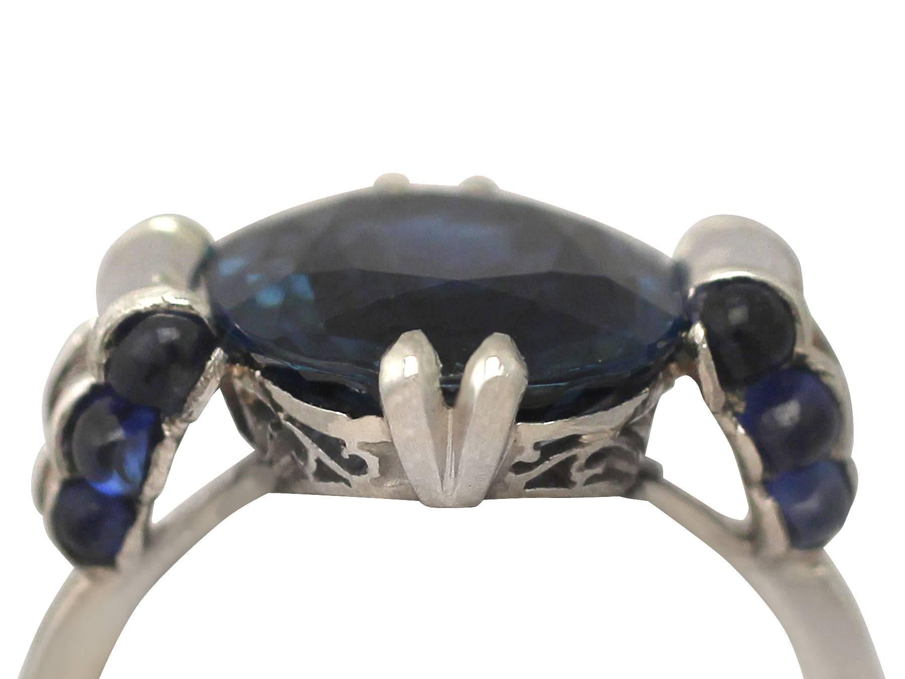 A stunning, fine and impressive Art Deco 5.22 Carat blue sapphire and platinum cocktail ring; part of our diverse antique jewelry and estate jewelry collections

This stunning, fine and impressive antique oval cut sapphire ring has been crafted in
