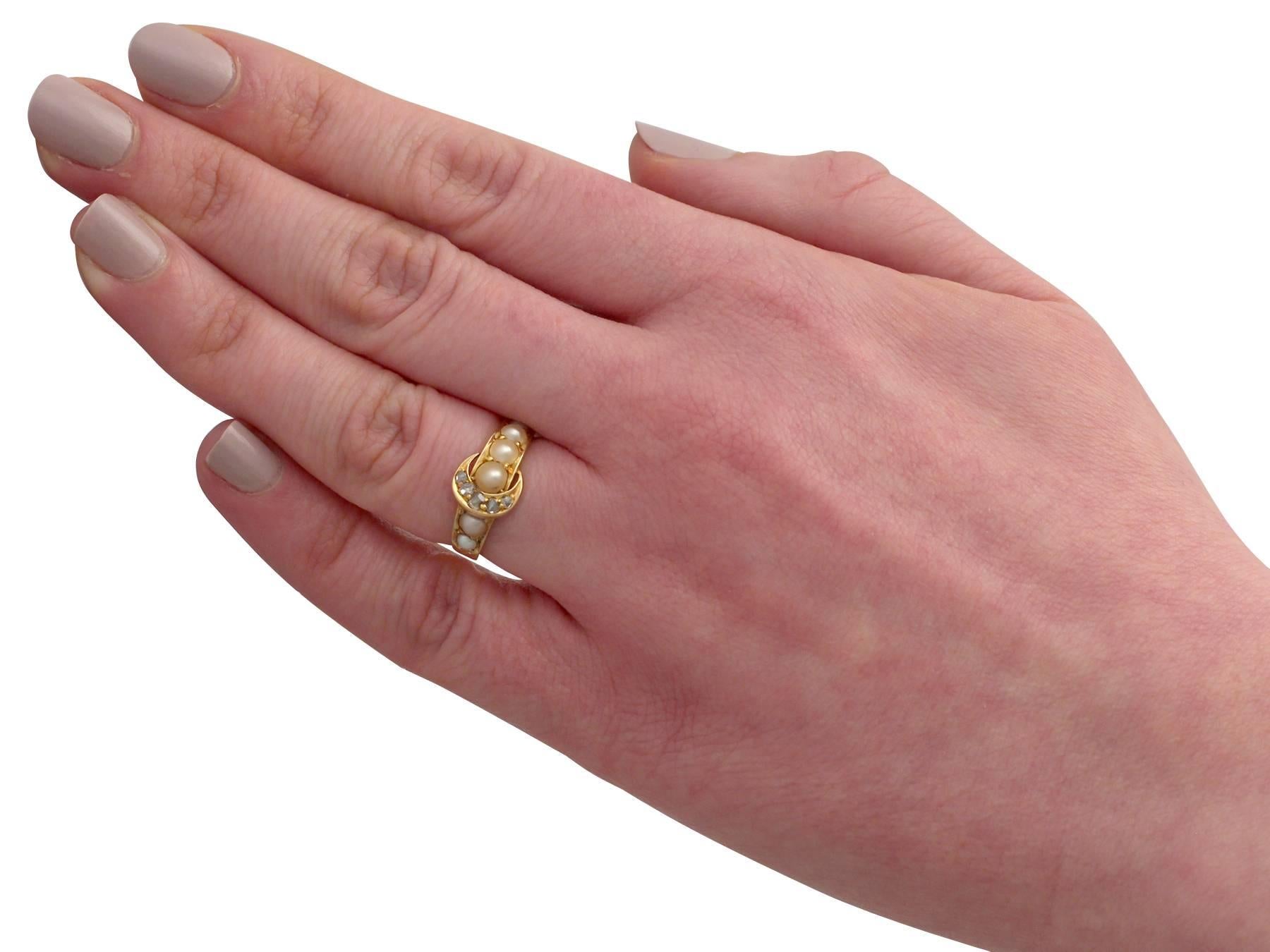1910s 0.15 Carat Diamond and Pearl, 18 Carat Yellow Gold 'Buckle' Ring 2