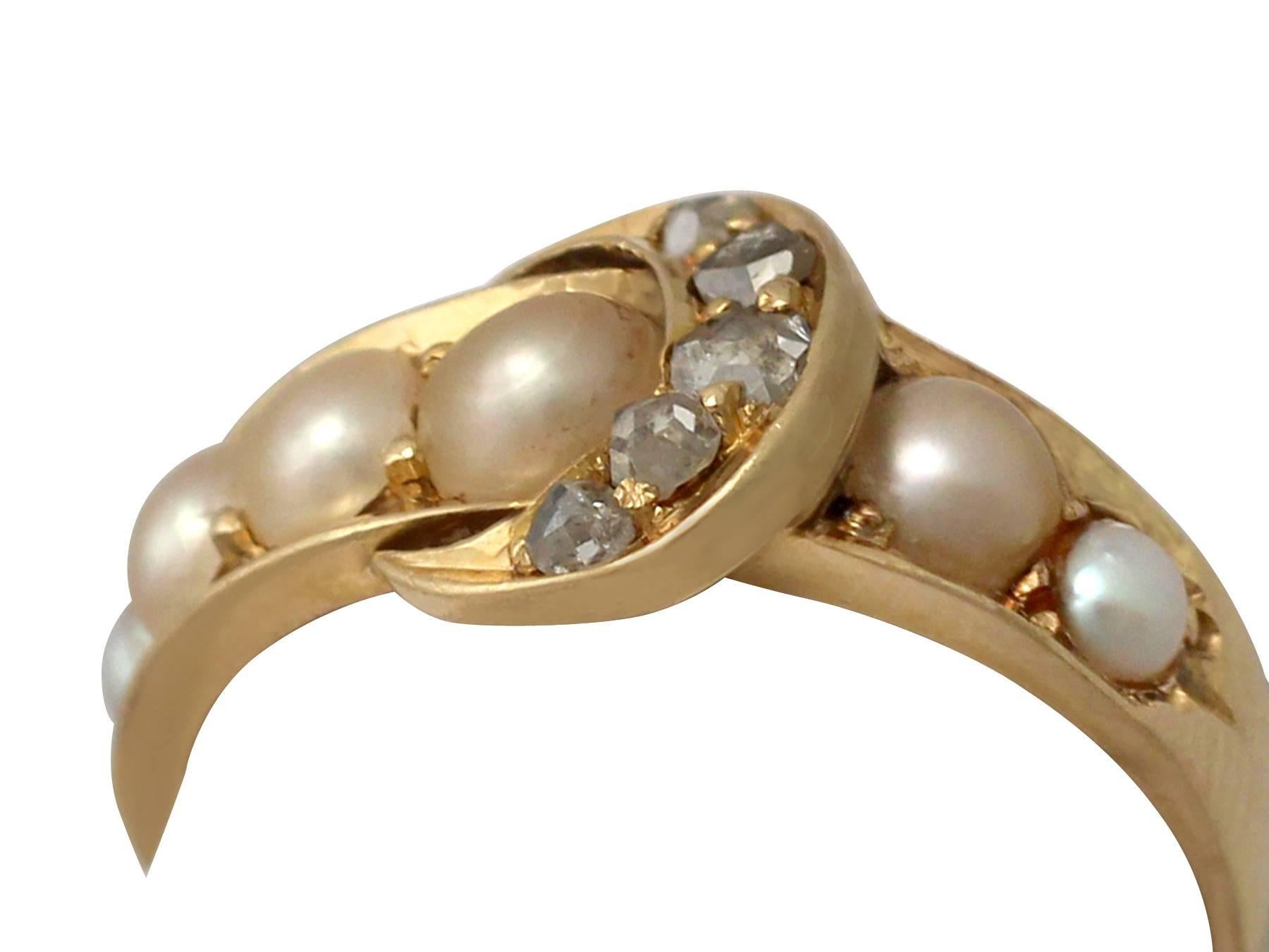 A fine and impressive antique 0.15 carat diamond and pearl, 18 karat yellow gold buckle style dress ring; part of our diverse antique jewelry and estate jewelry collections

This fine and impressive ladies buckle ring has been crafted in 18 k