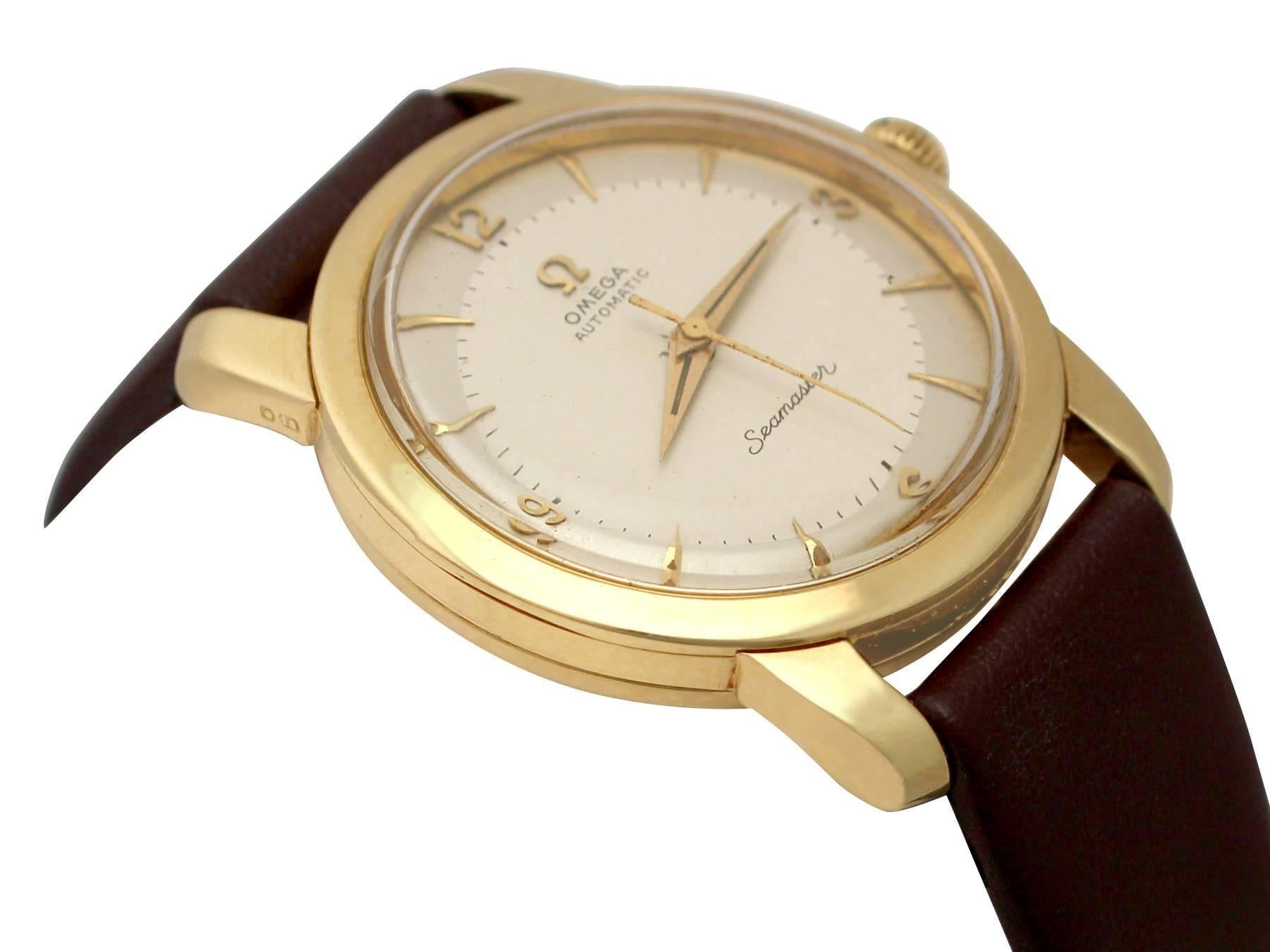 An impressive  automatic Omega Seamaster gents 18 karat yellow gold wrist watch; part of our watch collection.

This fine 1950s Omega Seamaster automatic watch has been crafted in 18k yellow gold.

The circular white dial displays gold colored 3,6,9