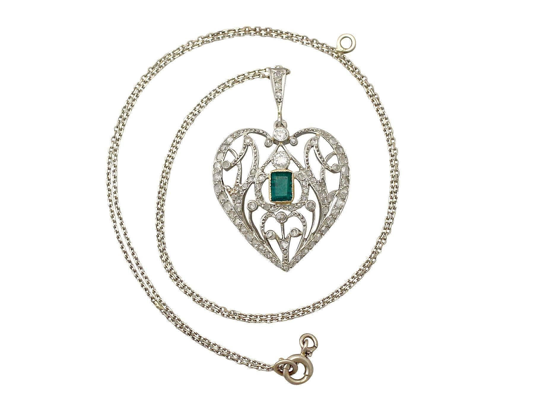 A fine Art Nouveau 0.33 carat emerald and 0.35 carat diamond, 9 karat gold heart shaped pendant; part of our diverse antique jewellery and estate jewelry collections

This fine and impressive diamond and emerald heart pendant has been crafted in 9 k