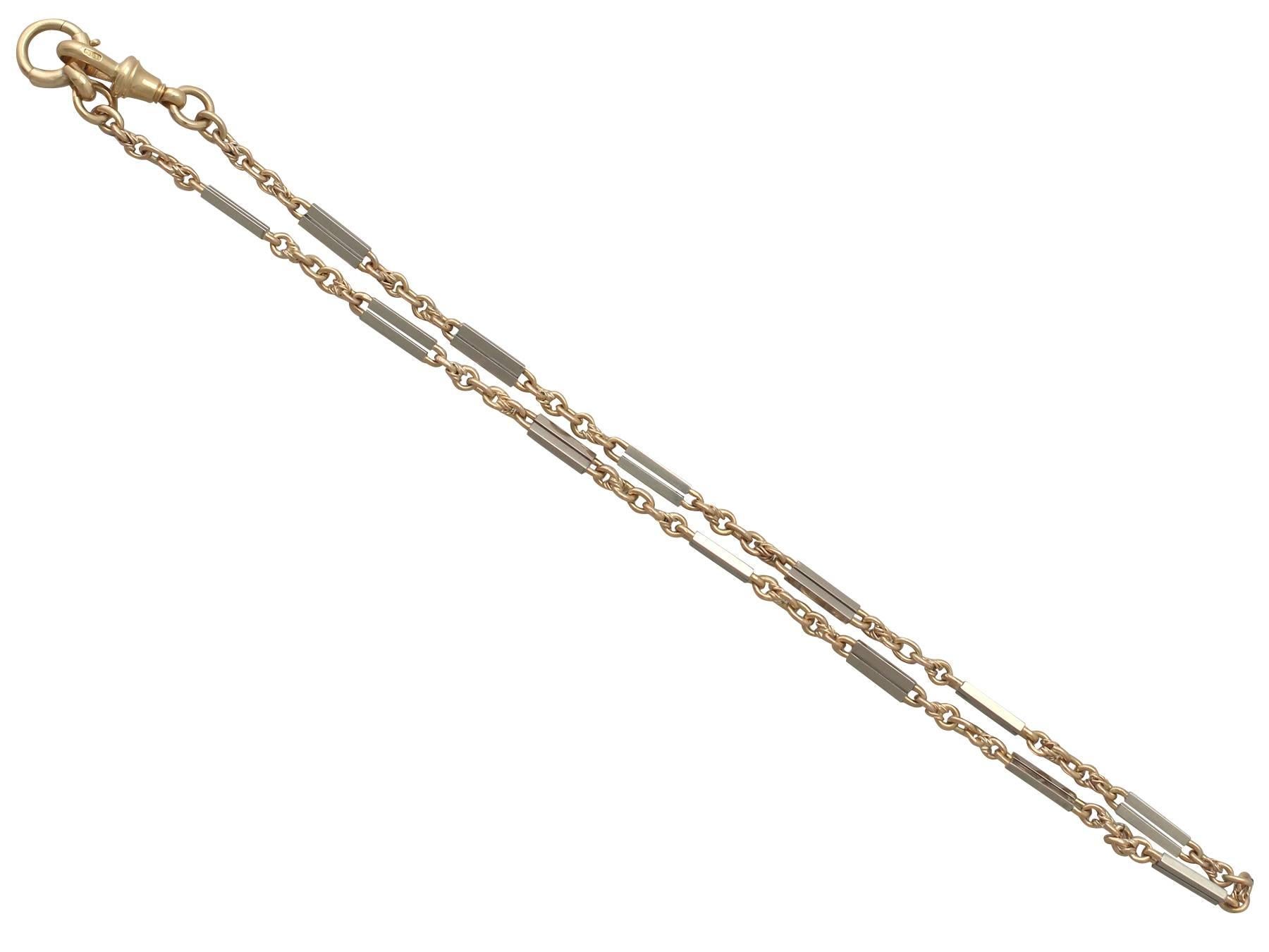A fine and impressive antique 18 karat yellow gold and platinum fancy style watch chain / bracelet; part of our diverse antique jewelry and estate jewelry collections 

This fine and impressive antique 1920's watch chain has been crafted in 18k