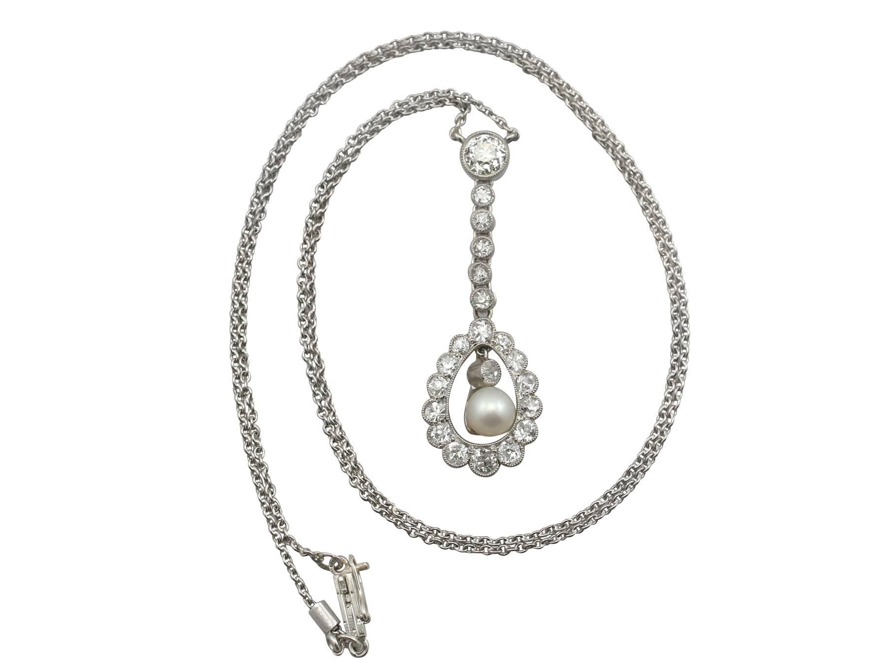 A stunning antique 1.10 carat diamond, pearl and and platinum necklace; part of our diverse antique jewelry and estate jewelry collections

This stunning, fine and impressive diamond and pearl drop necklace has been crafted in platinum.

The