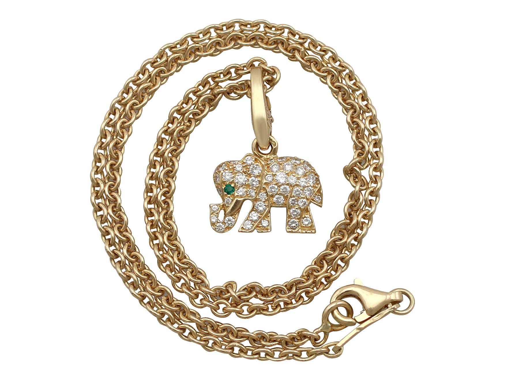 A fine and impressive 0.45 carat diamond and 0.02 carat emerald, 18 karat yellow gold pendant by 'Carter'; part of our diverse jewelry and estate jewelry collections

This fine and impressive Cartier elephant has been crafted in 18k yellow