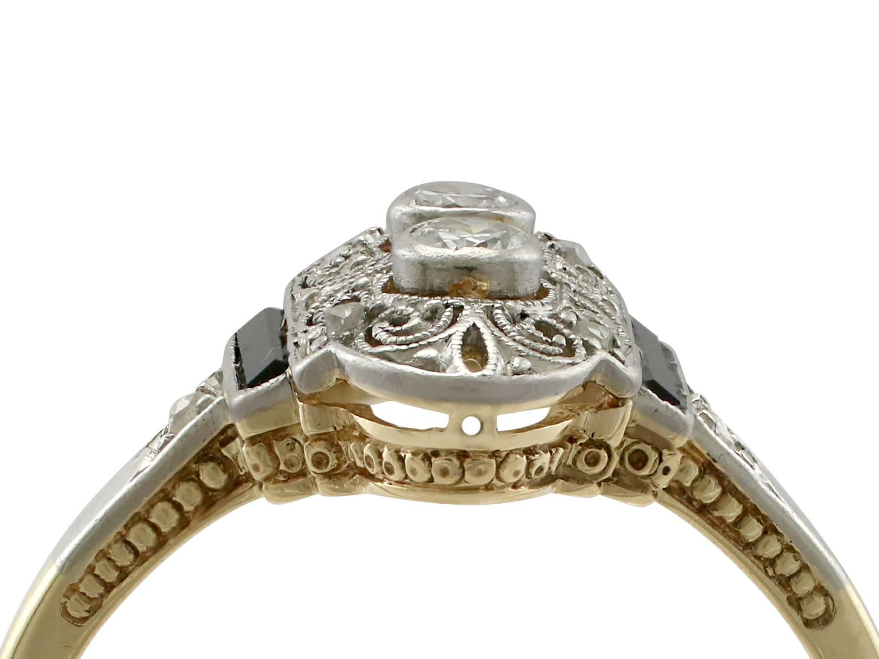 An impressive 0.13 carat diamond and black onyx, 14 karat yellow gold and 14 karat white gold set cocktail ring; part of our diverse antique jewelry and estate jewelry collections

This fine and impressive antique diamond and onyx ring has been